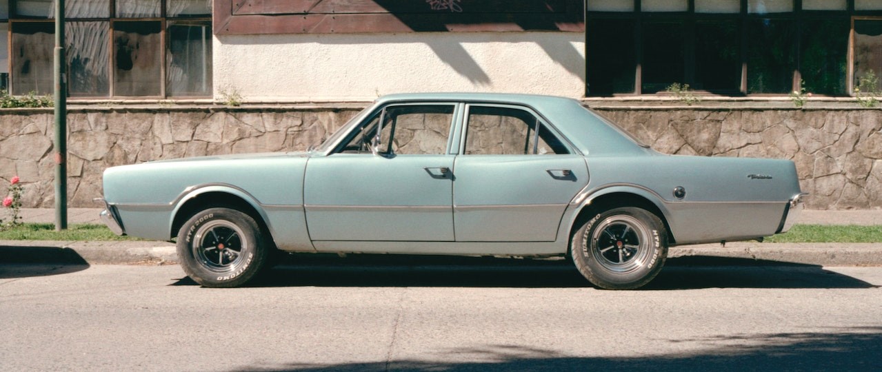 A Sedan Vintage Car Parked on the Road | Breast Cancer Car Donations