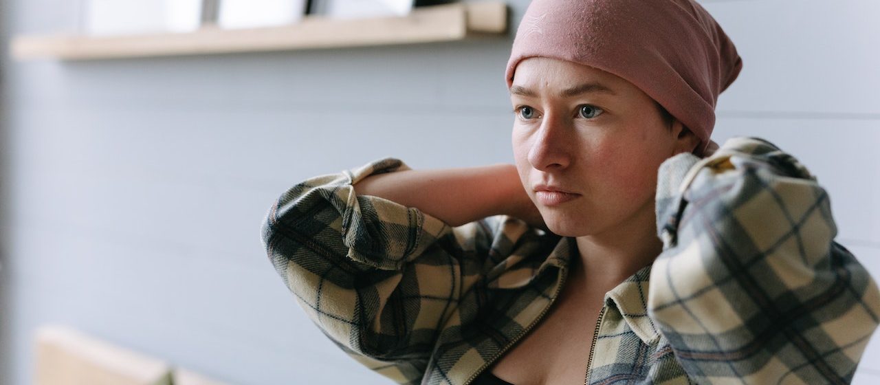 A Woman Wearing a Head Wrap | Breast Cancer Car Donations