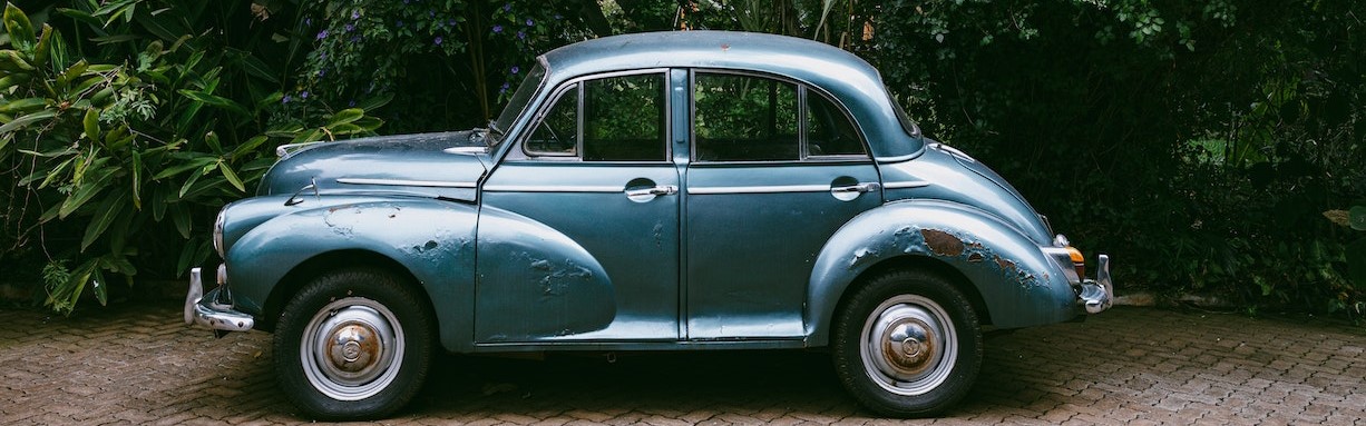 Blue Classic Car Parked on Pavement | Breast Cancer Car Donations