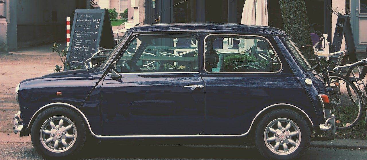 Blue hatchback parked | Breast Cancer Car Donations