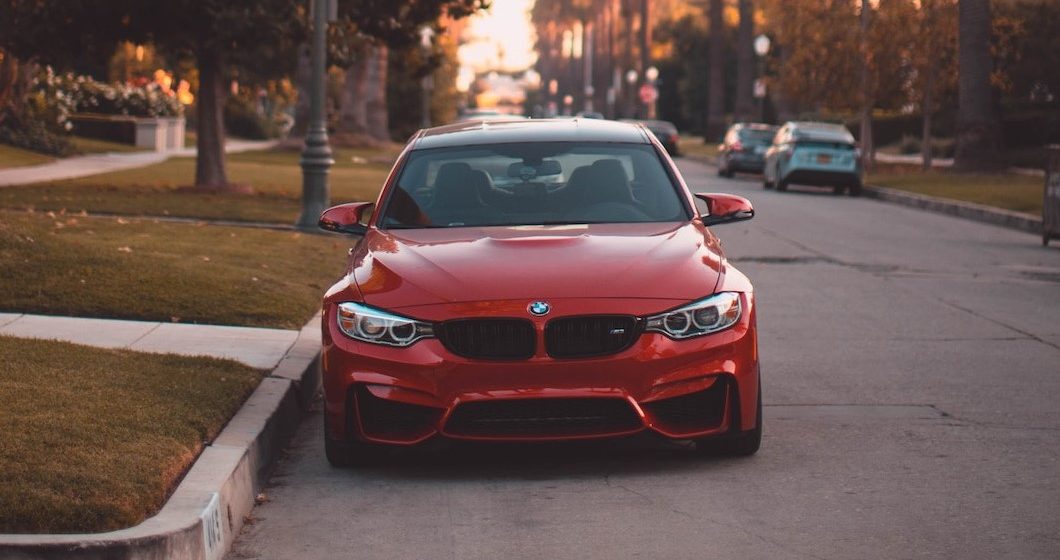 Red Car Parked on the Side of the Road | Breast Cancer Car Donations