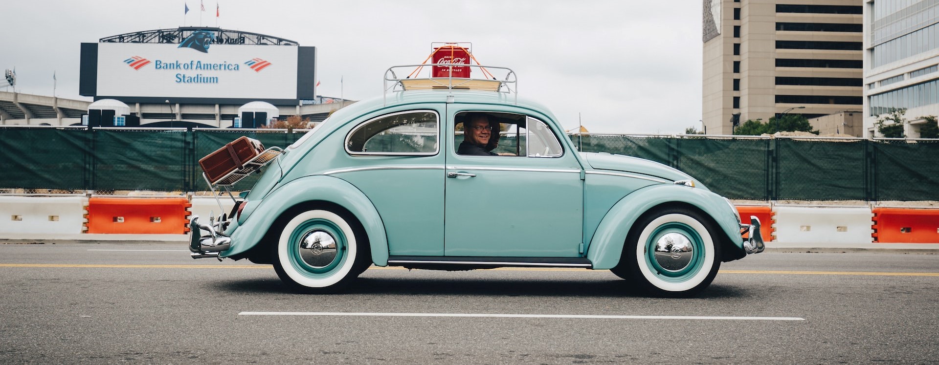 Teal volkswagern on the road | Breast Cancer Car Donations