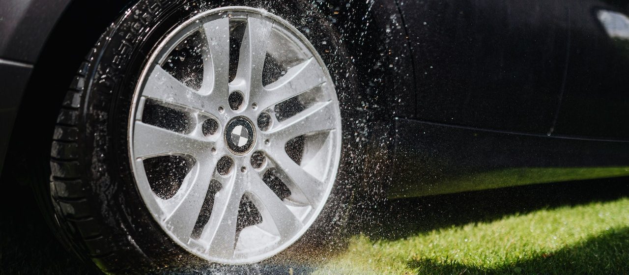 Water being Sprayed on a Wheel of a Car | Breast Cancer Car Donations