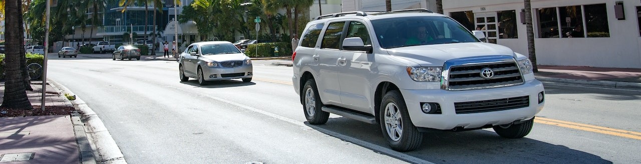 White Toyota Fortuner on the Road | Breast Cancer Car Donations