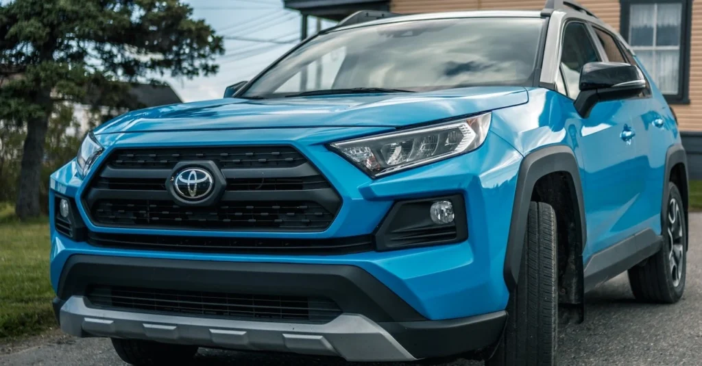 Blue SUV parked on a quiet street, showcasing modern design and vibrant color