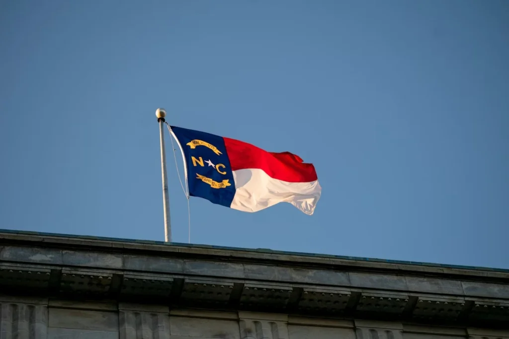 A flag flying on top of a building