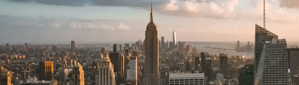 city skyline under cloudy sky during daytime