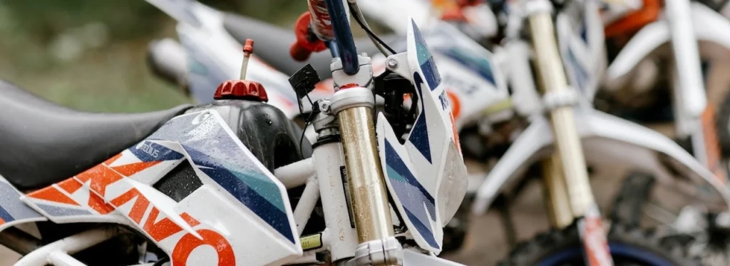 Detailed view of parked dirt bikes ready for motocross adventure outdoors