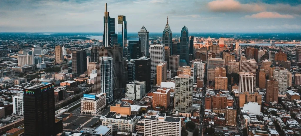 Stunning aerial shot capturing Philadelphia's iconic downtown skyline under a cloudy sky