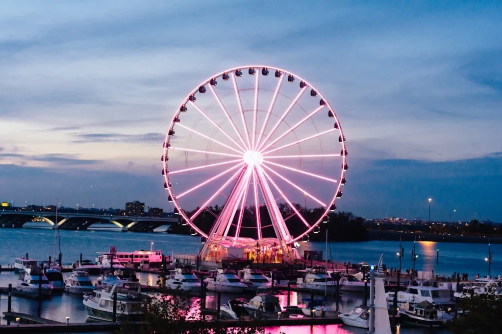 Low exposure photo of London eye under blue sky