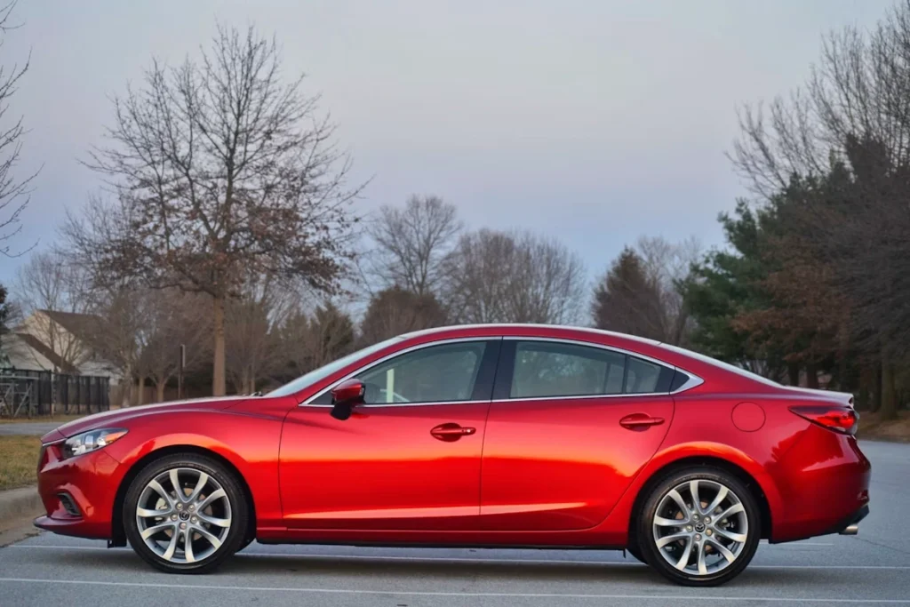 Red Mazda 6 parked on a street