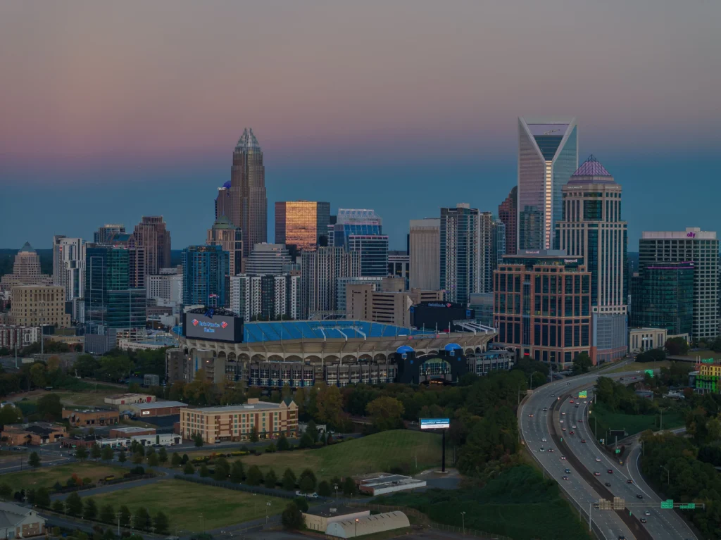 Aerial view of Charlotte skyline and Bank of America Stadium at dusk, North Carolina, USA